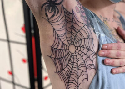 Spiderweb Armpit Tattoo